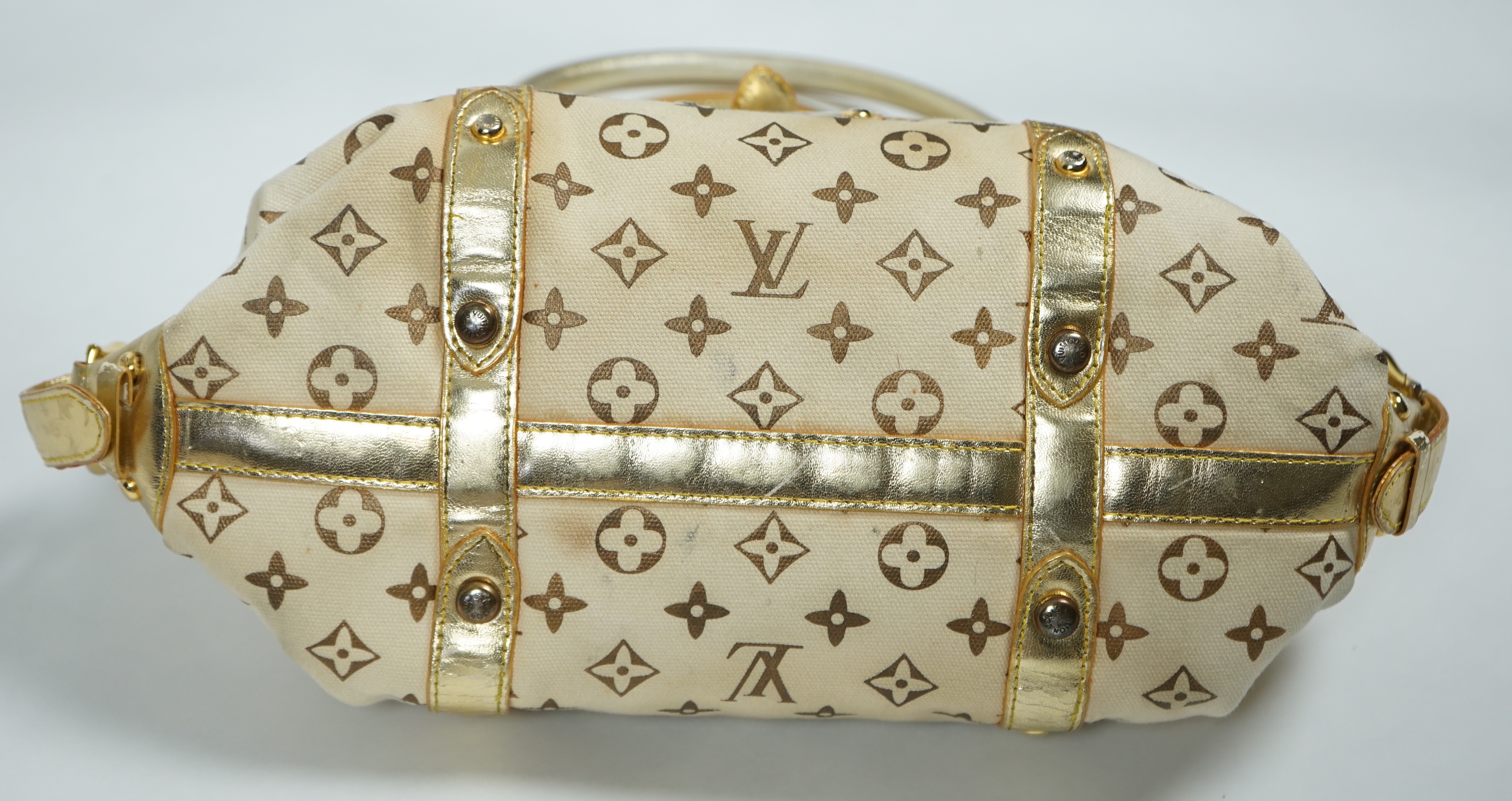 A vintage Louis Vuitton Theda beige and brown Monogram bag